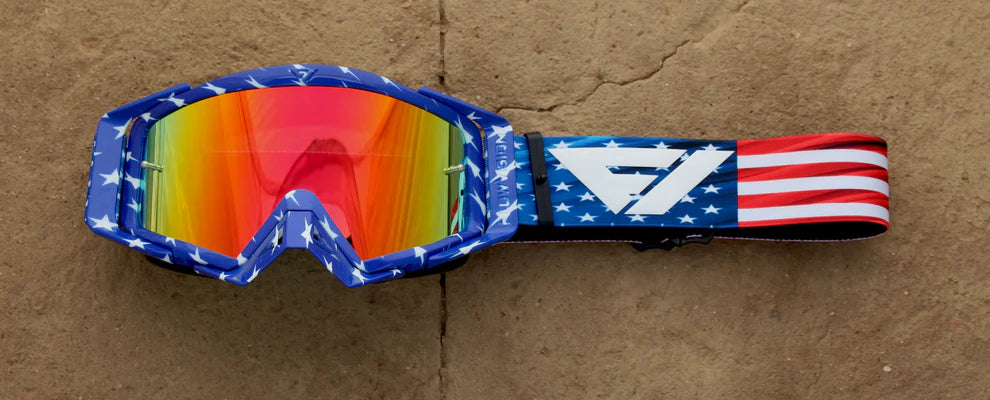 Goggles with colorful lens and American flag strap on a brown background