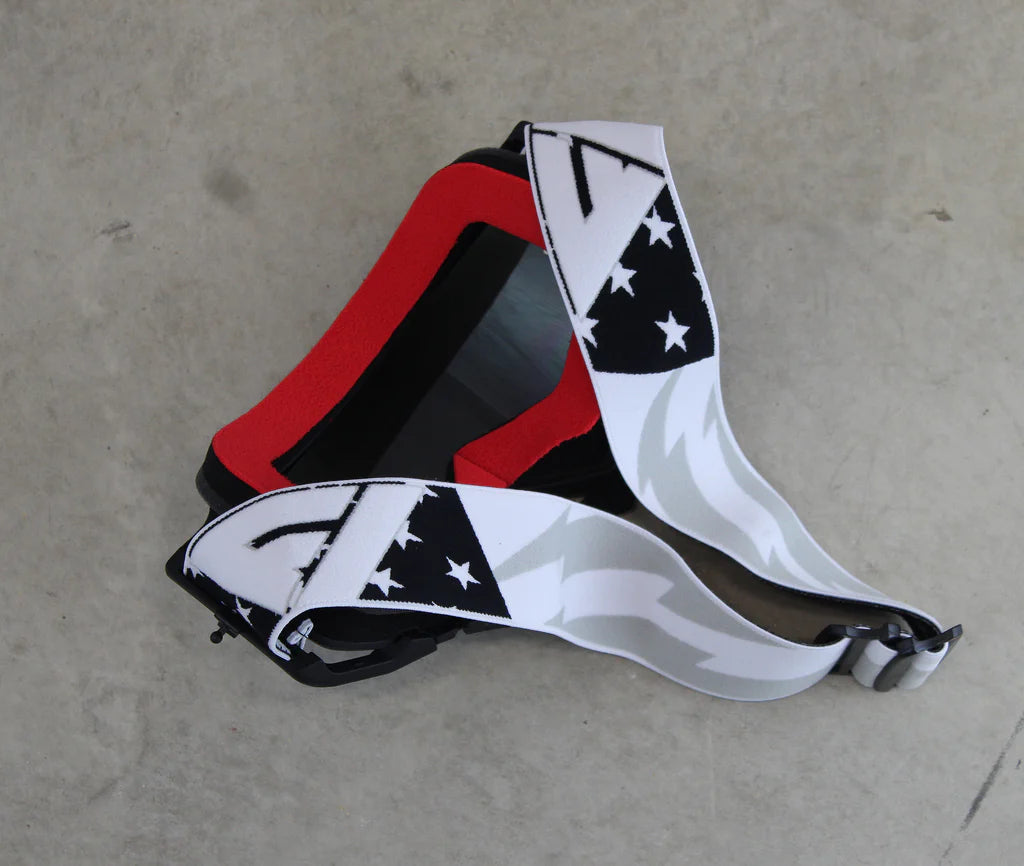 View of red goggle face foam, strap and lens