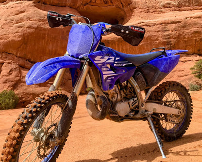 Blue Yamaha dirt bike on a rocky terrain