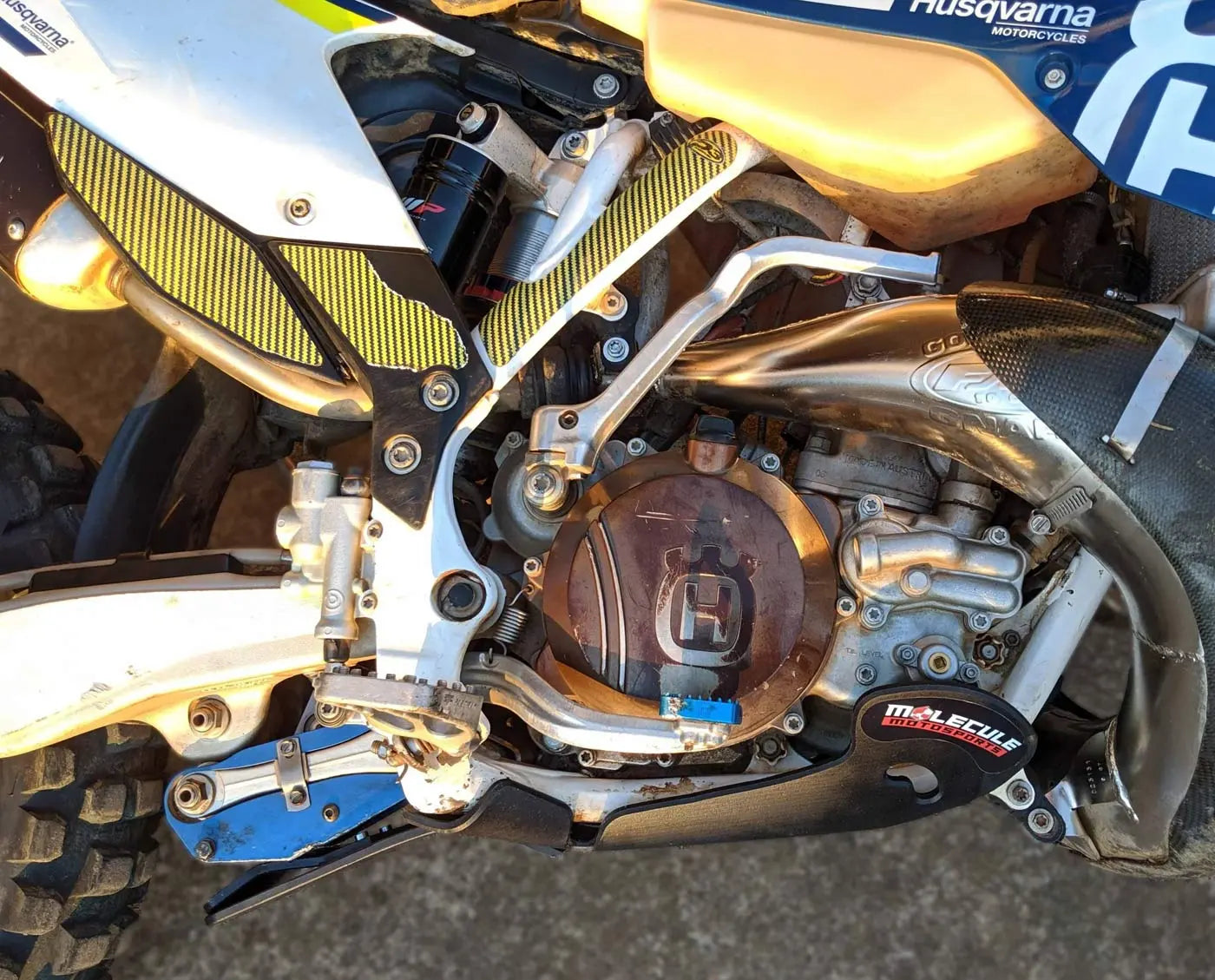 Close-up of a motorcycle engine with visible branding