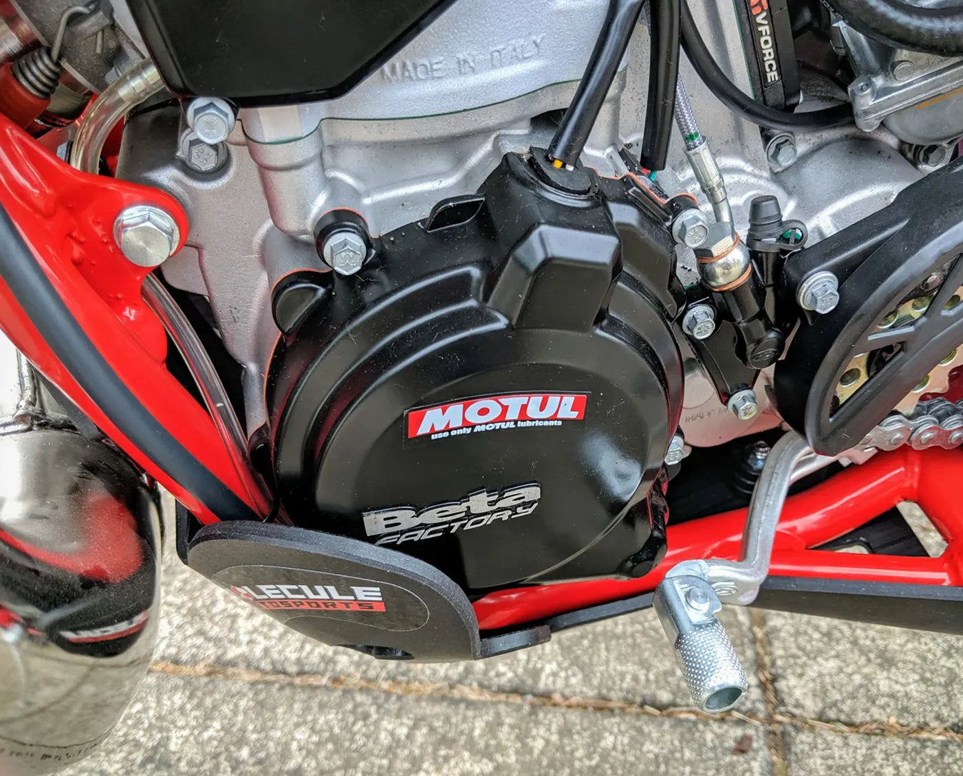 Close-up of a motorcycle engine case with Beta and Motul branding.