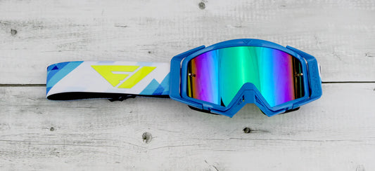 Blue goggles with colorful lens on a wooden surface