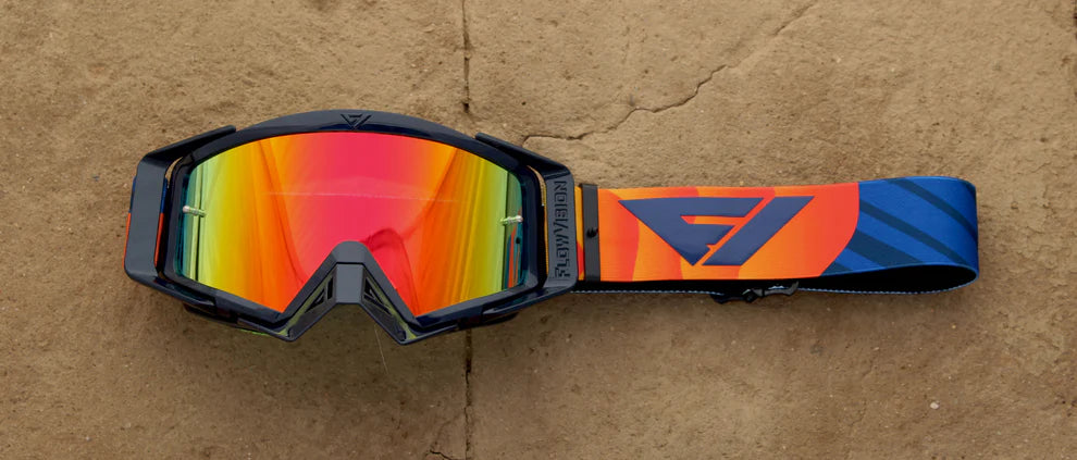 Multicolored goggles with a brand logo on a brown background