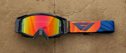 Multicolored goggles with a brand logo on a brown background