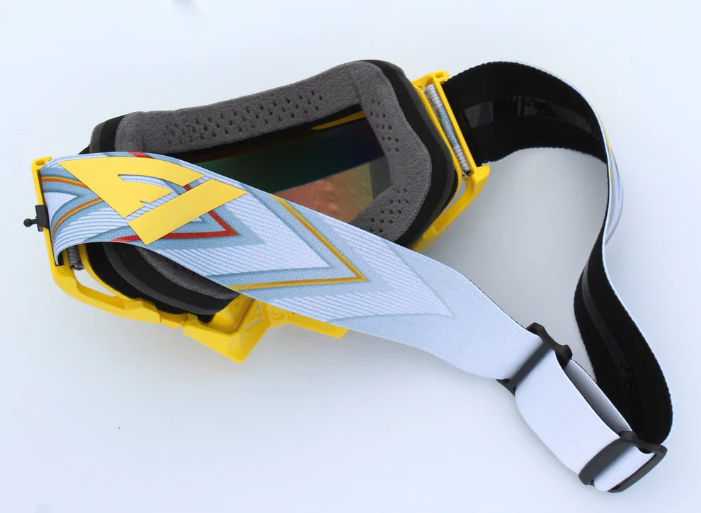 Motocross goggles with a colorful strap on a white background
