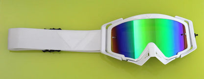 White goggles with colorful lenses on a green background