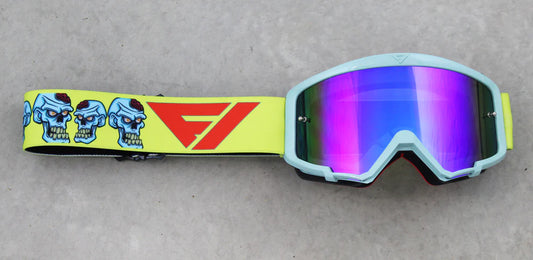 Goggles with colorful strap and reflective lenses on a gray background