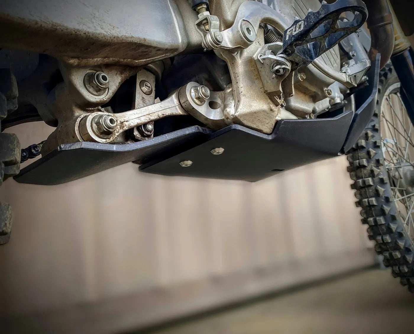 Close-up of a motorcycle skid plate by Molecule Motorsports