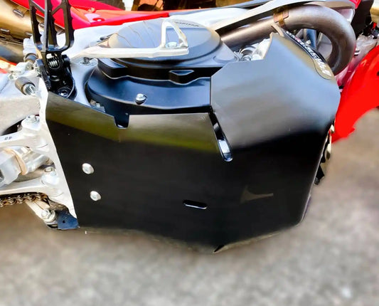 Close-up of a motorcycle engine cover with visible branding.