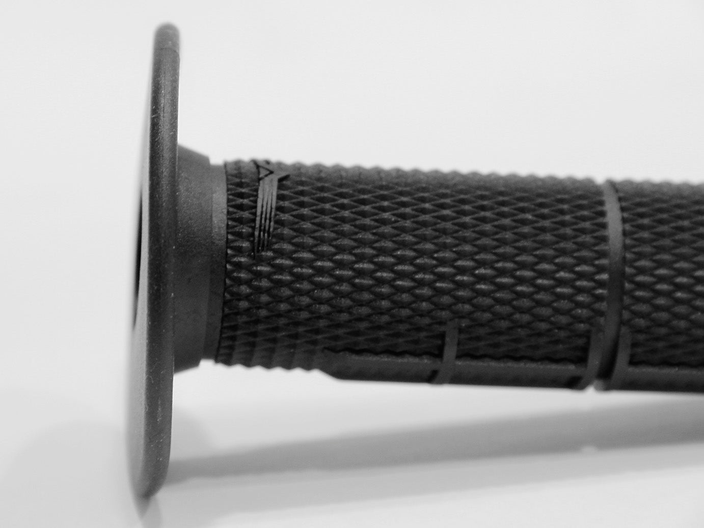 Black Grip showing safety wire grooves